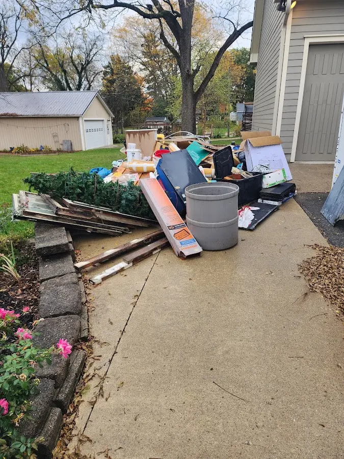 Dumpster being loaded with debris for 3 Yard Dumpster Rental in Pennsauken